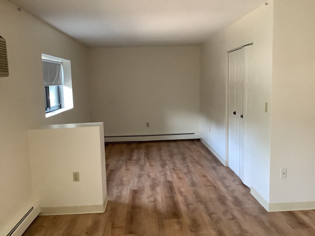 50 Cambridge Road, Unit 208 Woburn, MA 01801 - Photo 3 of 8 wooden floor in a room