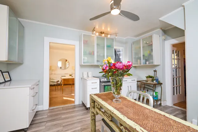 a dining room with furniture and chandelier