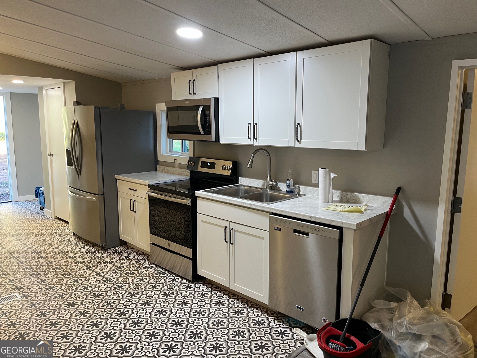 200 Cheatham Drive Athens, GA 30606 - Photo 2 of 36 a kitchen with a sink appliances and cabinets