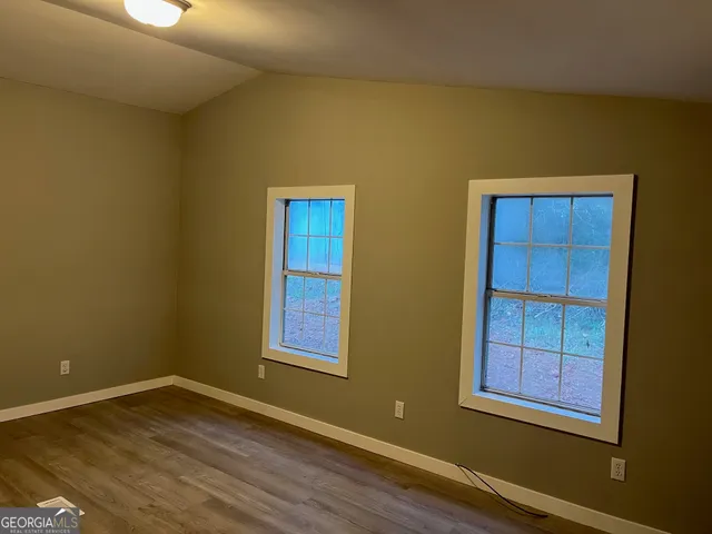 a view of a wooden fence