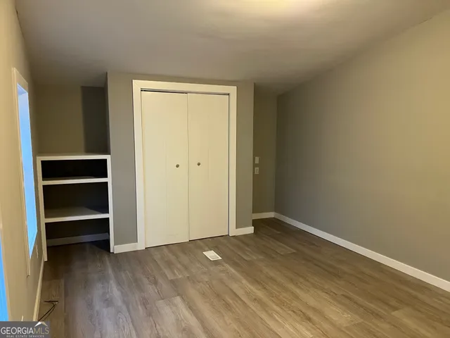 a view of balcony with wooden floor and fence