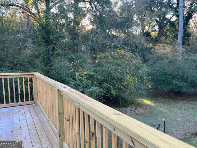 a view of a yard with a tree