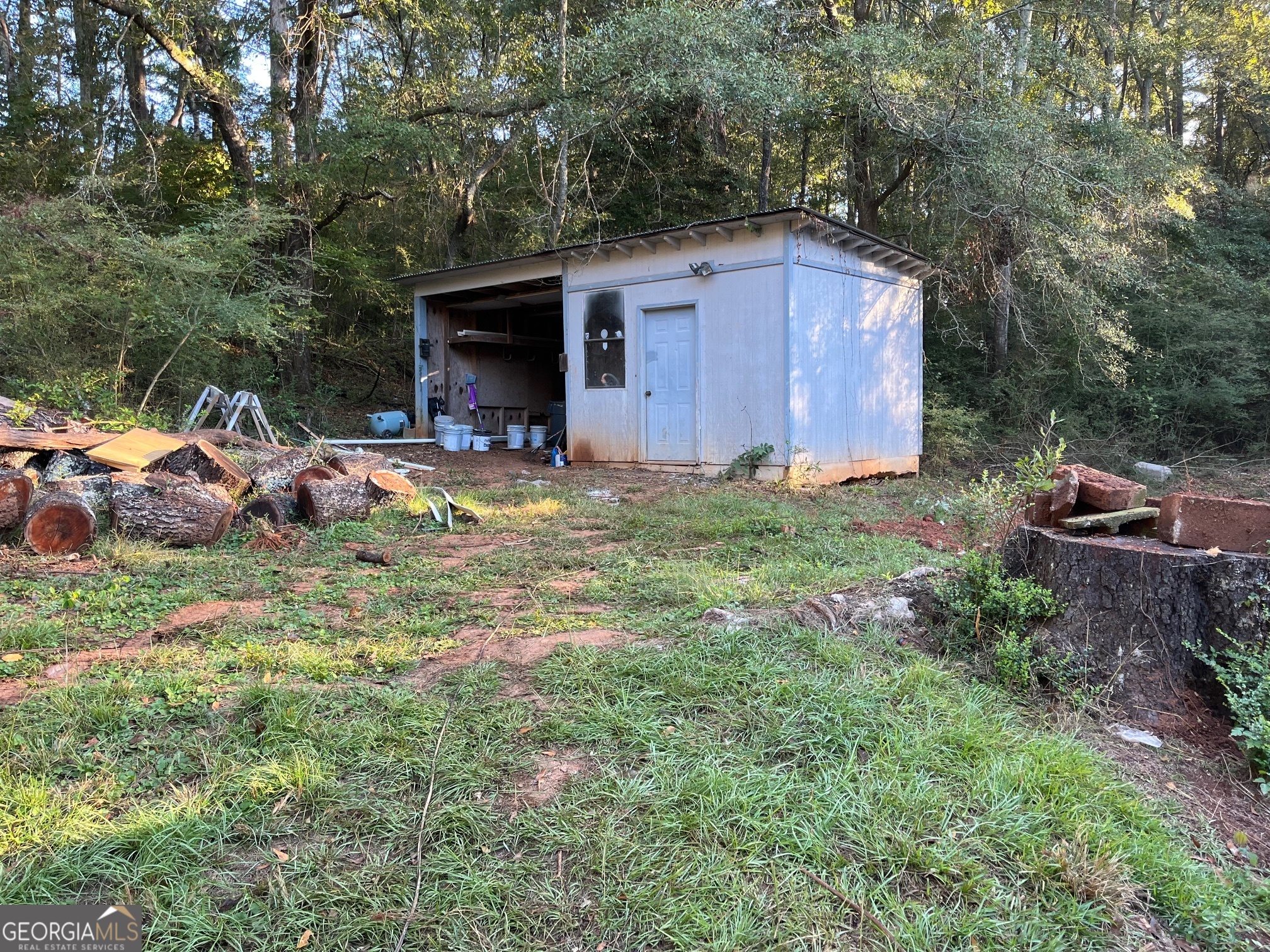 200 Cheatham Drive Athens, GA 30606 - Photo 36 of 36 a view of a backyard with table and chairs and barbeque grill