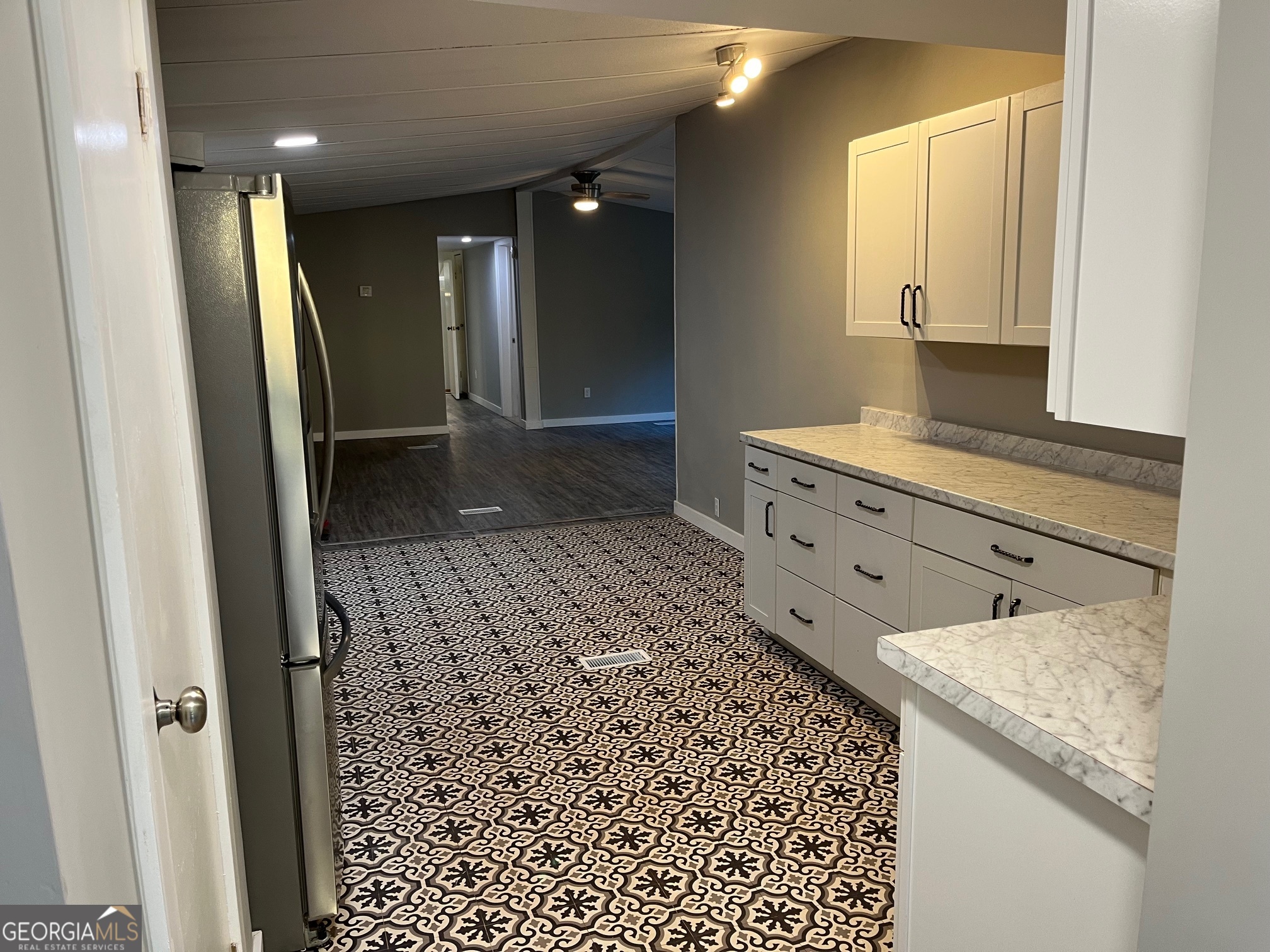 200 Cheatham Drive Athens, GA 30606 - Photo 5 of 36 a bathroom with a granite countertop sink a toilet a mirror and shower