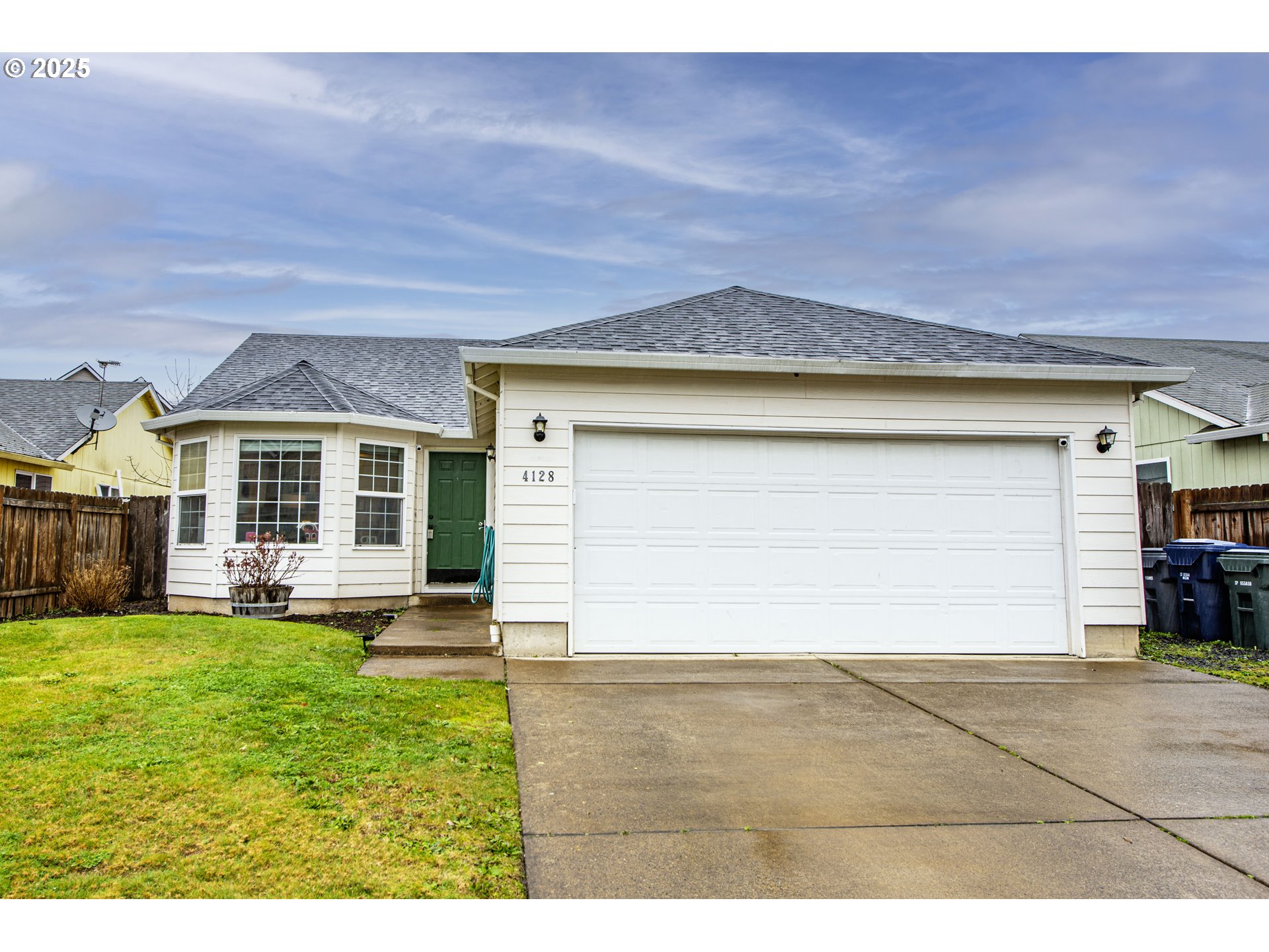 4128 Forsythia Street Springfield, OR 97478 - Photo 1 of 27 a view of a house with a yard and garage