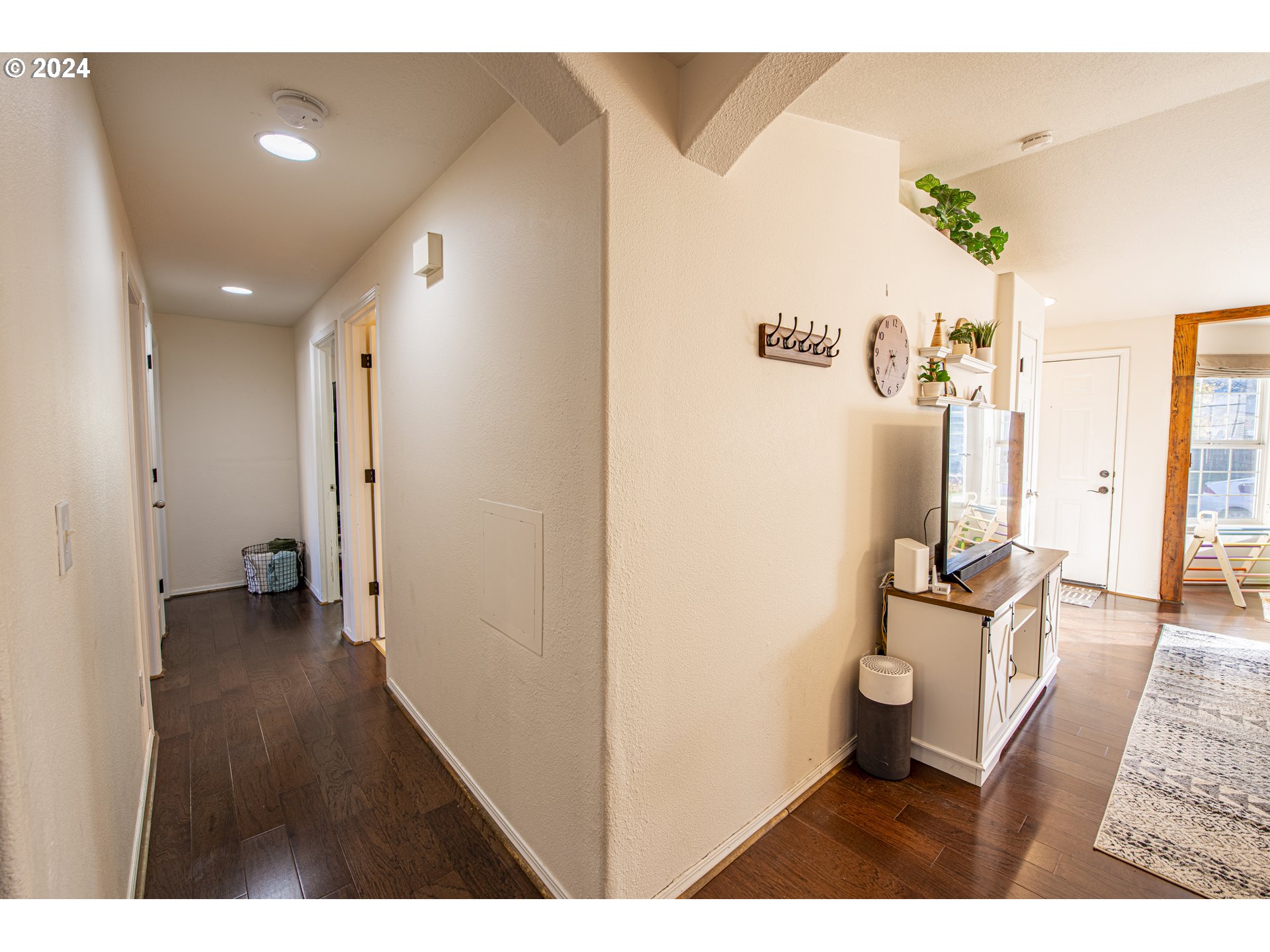 4128 Forsythia Street Springfield, OR 97478 - Photo 11 of 27 a view of a hallway and a livingroom with furniture
