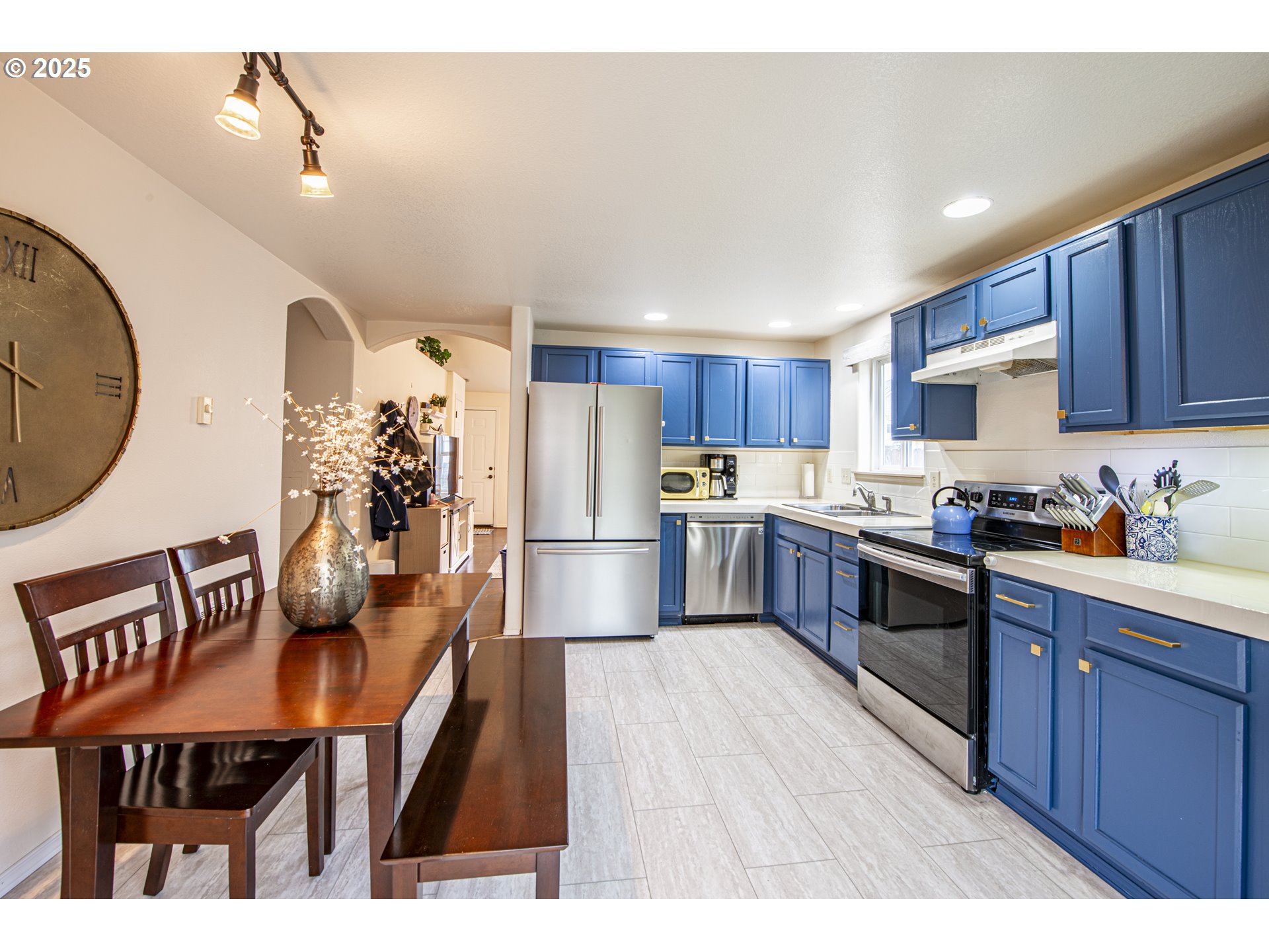 4128 Forsythia Street Springfield, OR 97478 - Photo 13 of 27 a kitchen with granite countertop a sink stainless steel appliances and cabinets