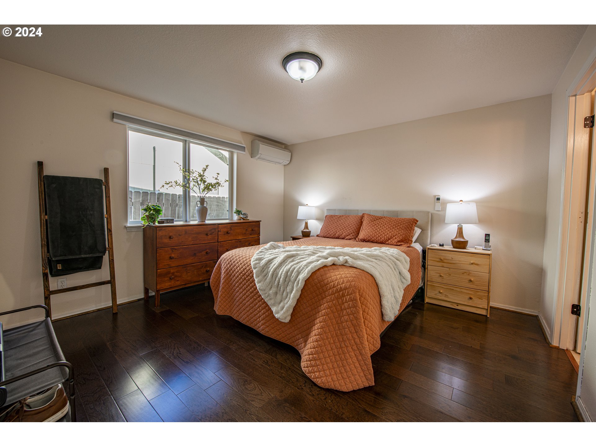 4128 Forsythia Street Springfield, OR 97478 - Photo 19 of 27 a bedroom with a bed and a flat screen tv
