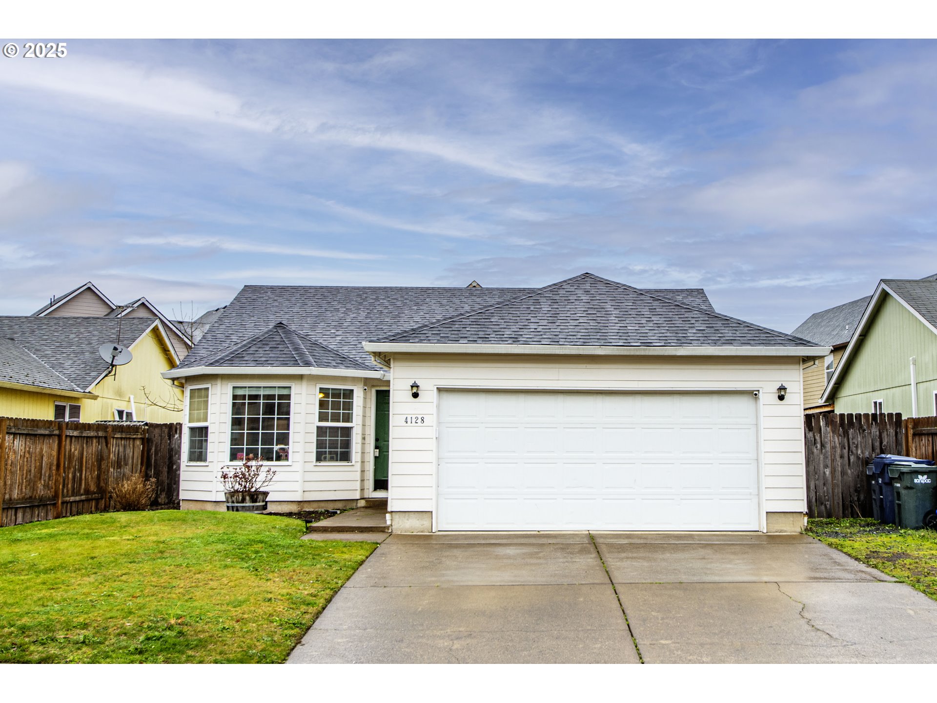 4128 Forsythia Street Springfield, OR 97478 - Photo 2 of 27 a front view of a house with a yard and outdoor seating