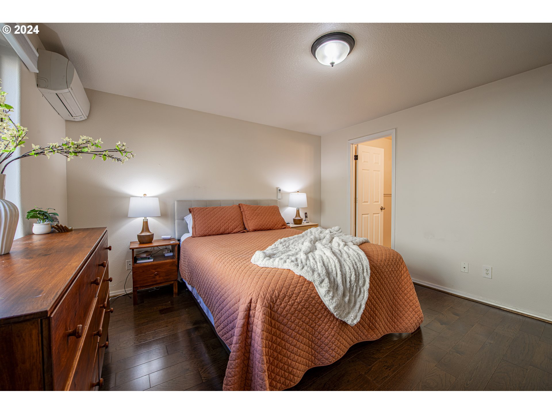 4128 Forsythia Street Springfield, OR 97478 - Photo 21 of 27 a bedroom with a bed and wooden floor