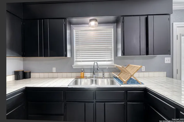 a kitchen with a sink and a window