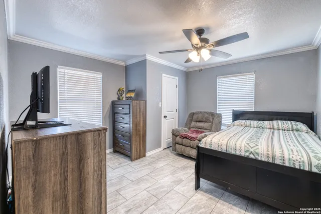 a bed room with a bed and a chandelier