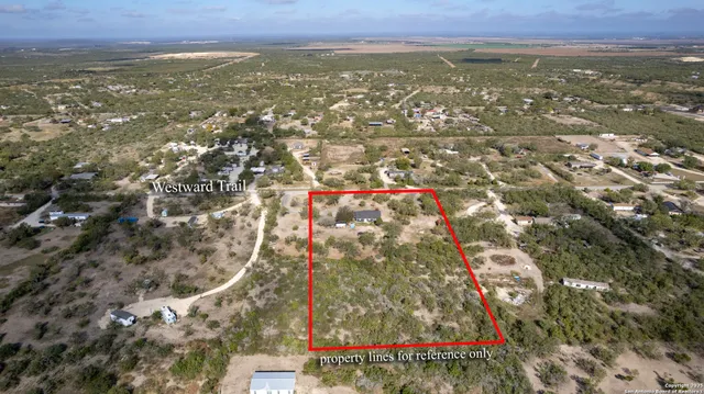 an aerial view of residential building and green space