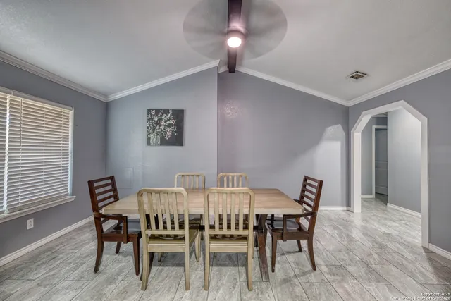 a view of a dining room with furniture and wooden floor