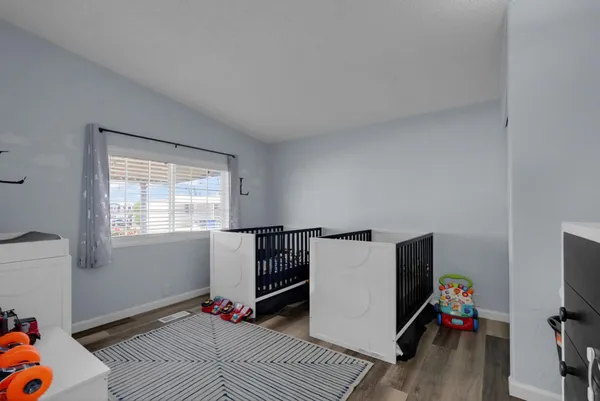 a room with furniture and wooden floor