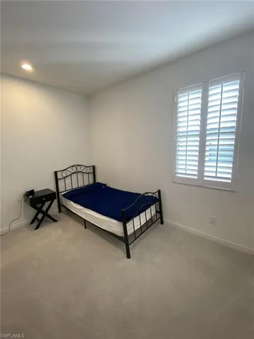 a room with a bed and a window