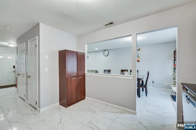 a bathroom with a sink mirror vanity and toilet
