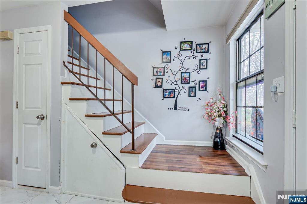 304 Maplecrest Road, Unit 304 Edison, NJ 08820 - Photo 24 of 38 a view of entryway livingroom and hall with wooden floor