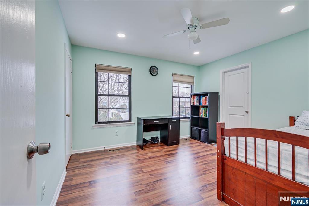 304 Maplecrest Road, Unit 304 Edison, NJ 08820 - Photo 29 of 38 a view of a livingroom with fireplace window and wooden floor