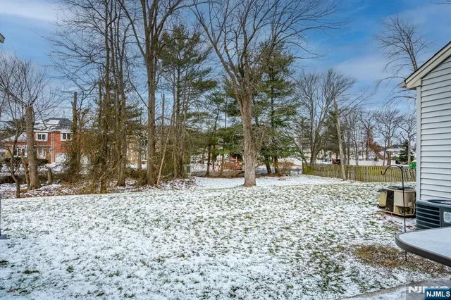 a view of a house with a backyard and porch