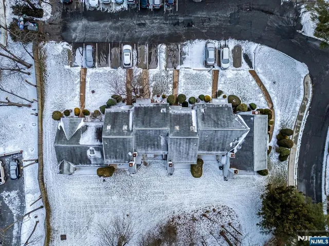 a picture of a wall with a white building