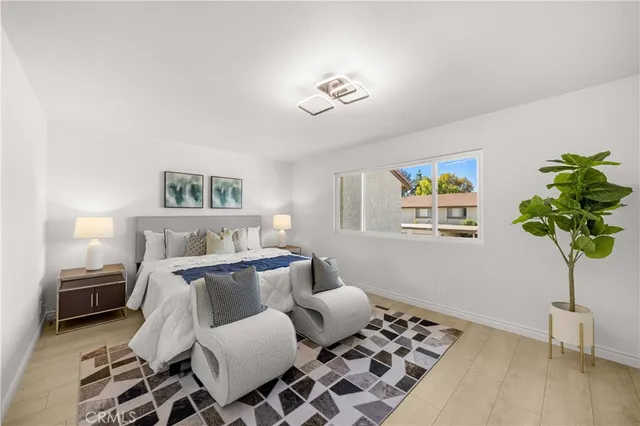 a living room with furniture a chandelier and a window