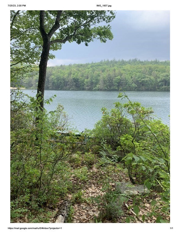 46 Dusty Road Erving, MA 01344 - Photo 13 of 14 a view of a lake with mountain in the background