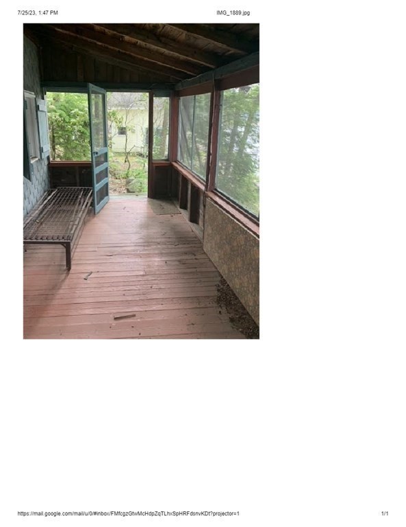 46 Dusty Road Erving, MA 01344 - Photo 3 of 14 a view of a living room with a floor to ceiling window and deck