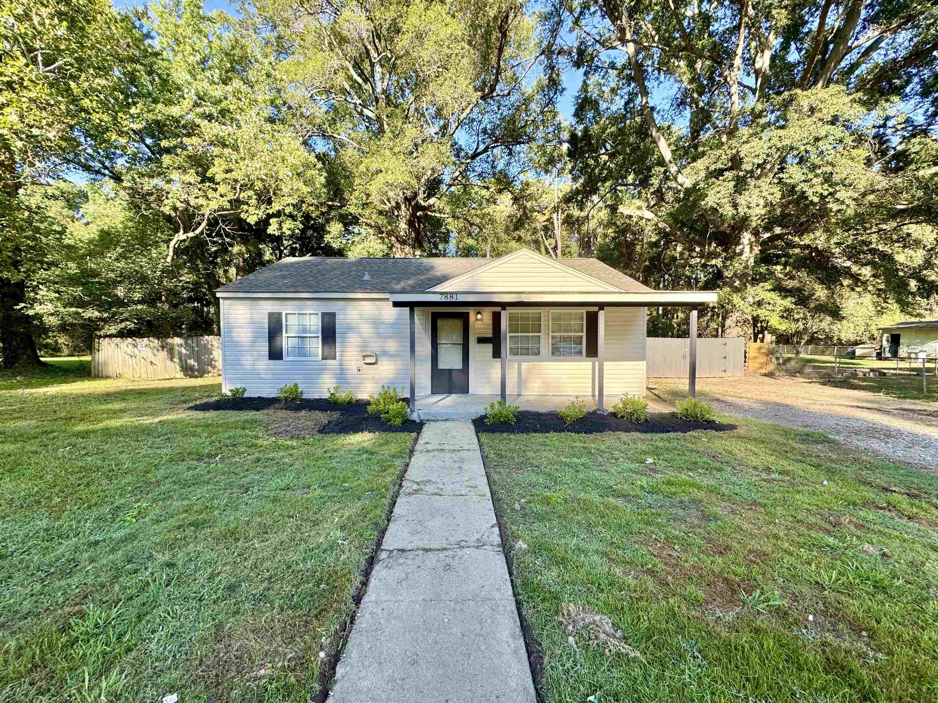 7881 Sherman Road Millington, TN 38053 - Photo 23 of 30 a front view of a house with yard