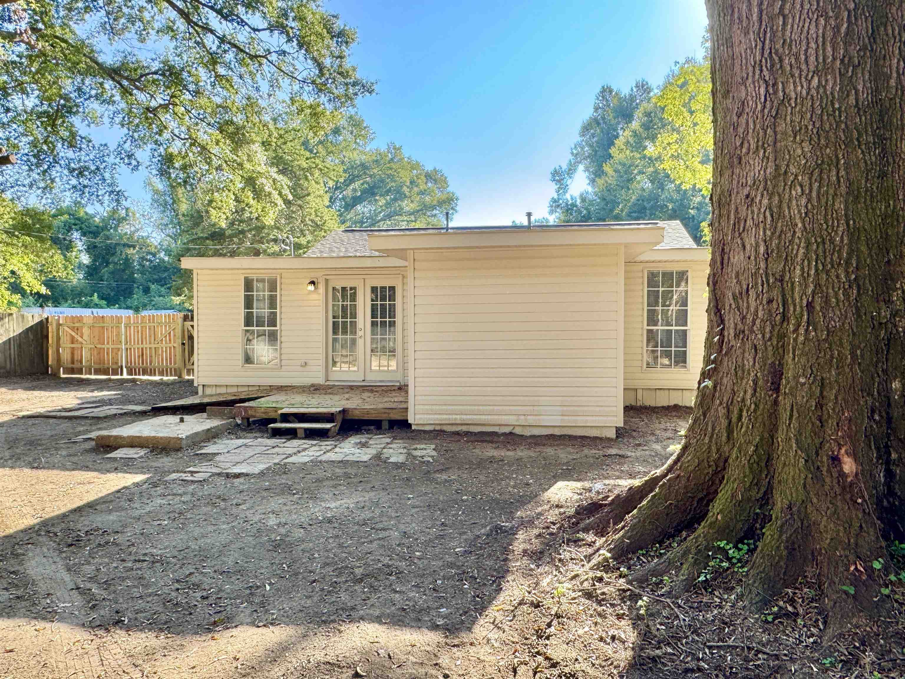 7881 Sherman Road Millington, TN 38053 - Photo 26 of 30 a view of a backyard with a tree