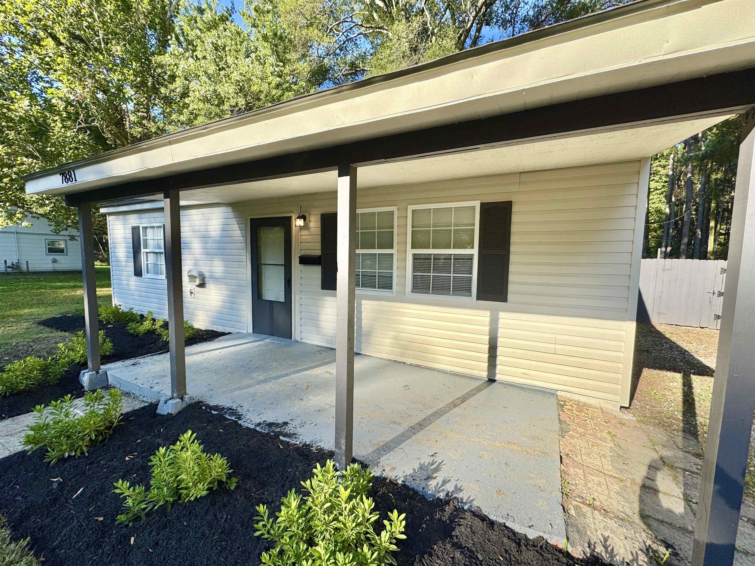 7881 Sherman Road Millington, TN 38053 - Photo 27 of 30 a front view of a house with a porch