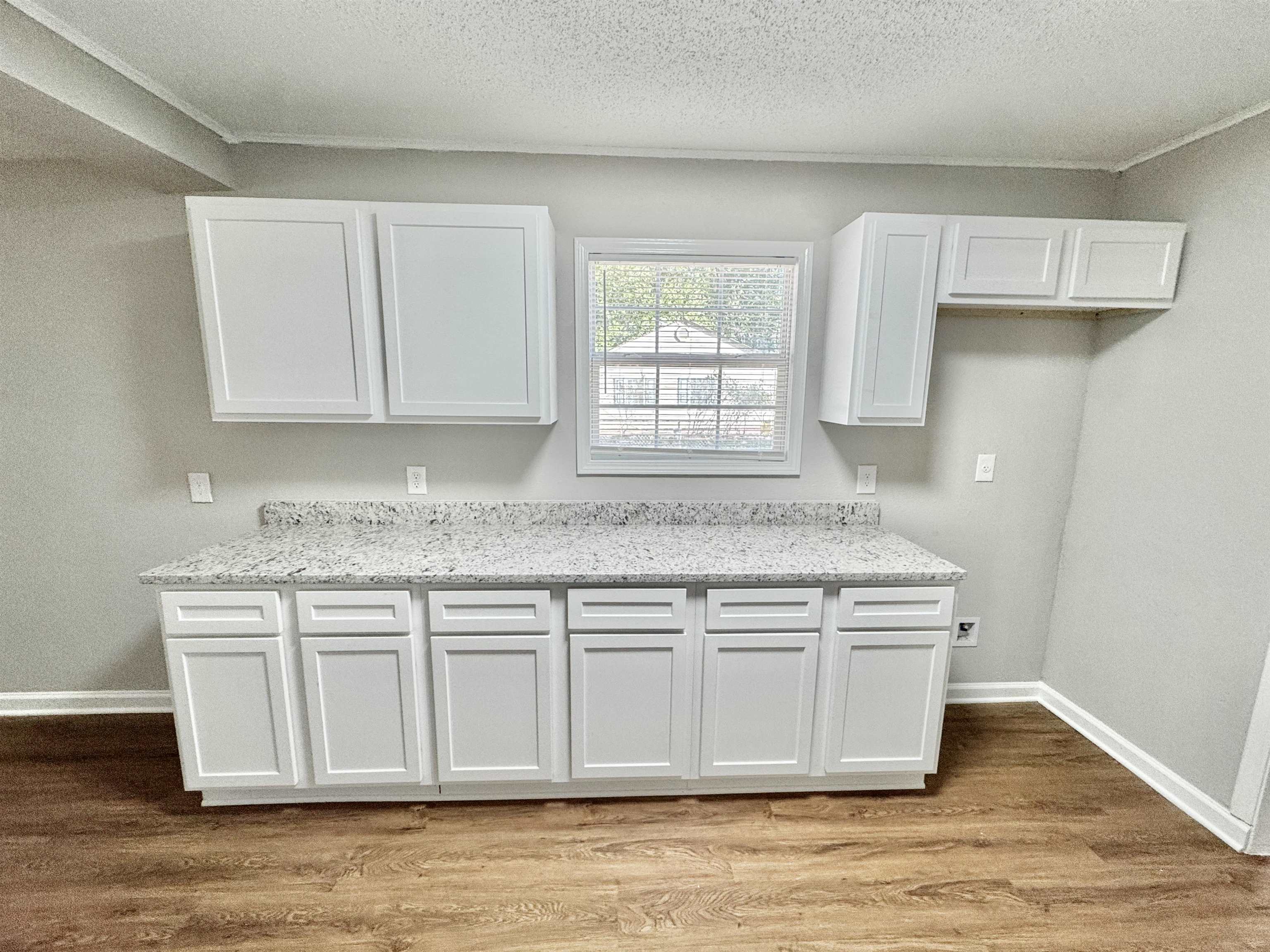 7881 Sherman Road Millington, TN 38053 - Photo 5 of 30 a kitchen with stainless steel appliances granite countertop a sink stove and cabinets
