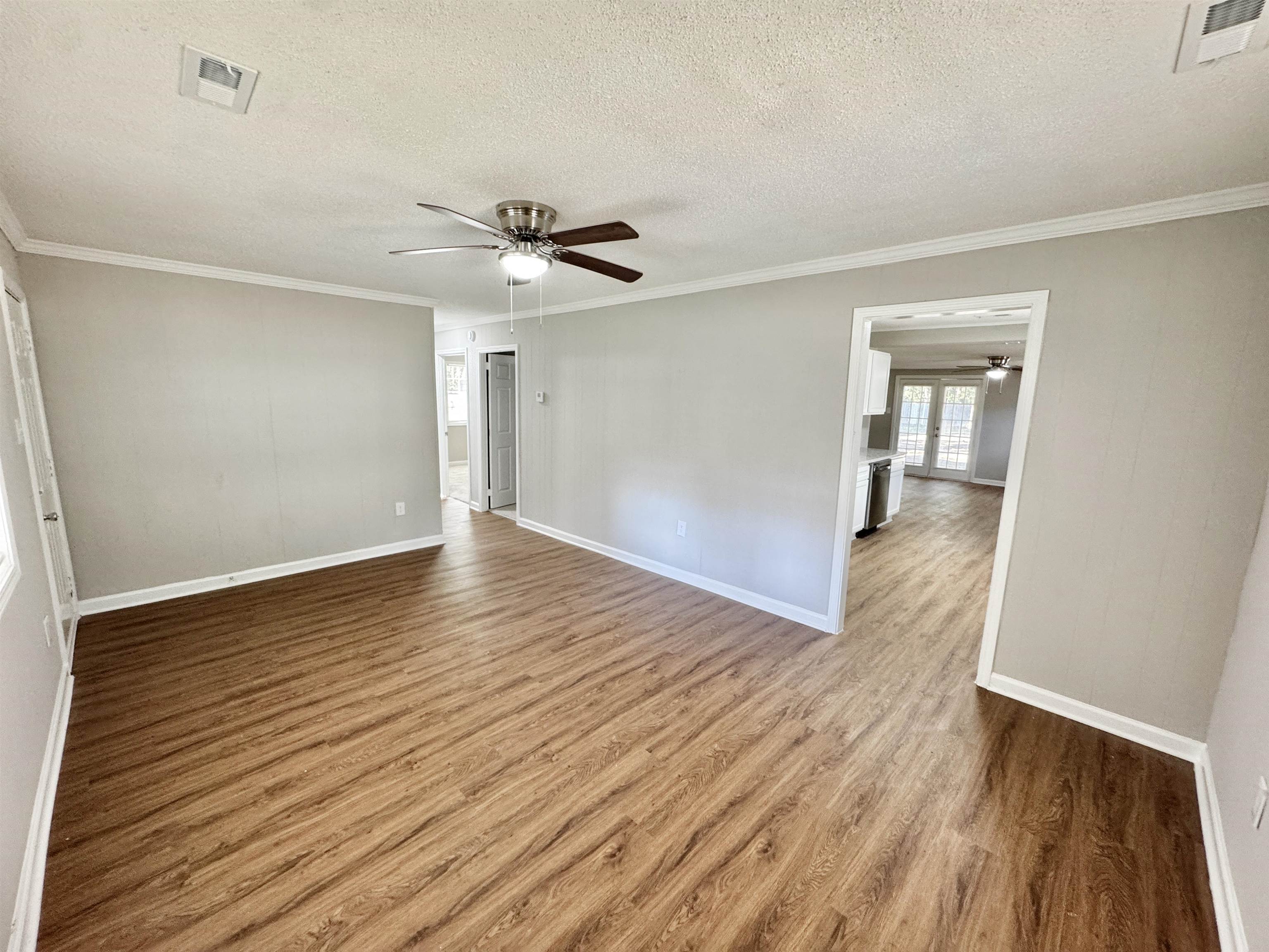 7881 Sherman Road Millington, TN 38053 - Photo 8 of 30 a view of empty room with wooden floor