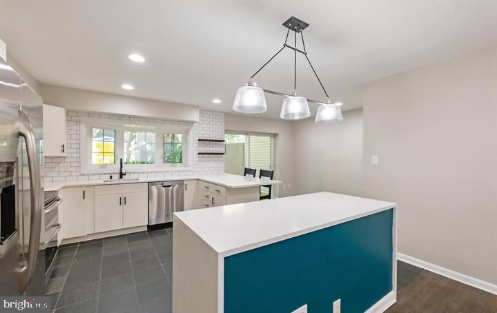 2317 37th Street Northwest Washington, DC 20007 - Photo 13 of 54 Modern kitchen with vibrant accents.