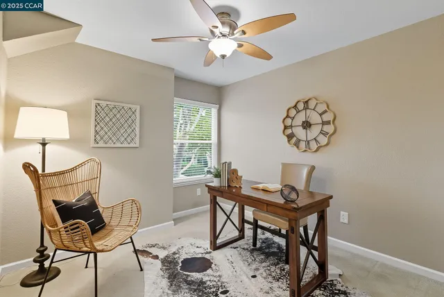 a workspace with furniture and a window