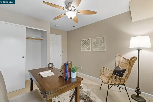 a view of a workspace with furniture