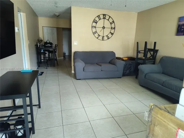 a living room with a couch and a table in it