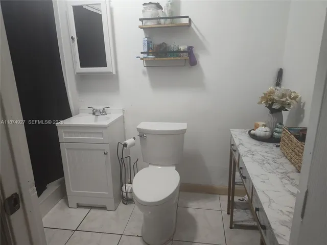 a bathroom with a toilet and a sink