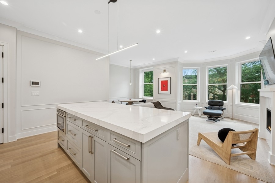 2136 North Cleveland Avenue, Unit 2 Chicago, IL 60614 - Photo 15 of 38 a view of a kitchen with a sink and wooden floor