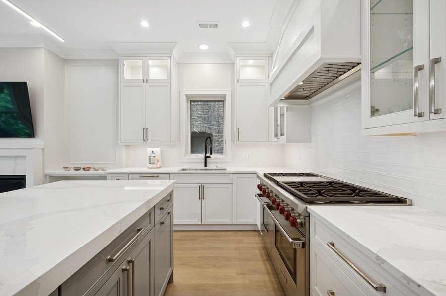 2136 North Cleveland Avenue, Unit 2 Chicago, IL 60614 - Photo 16 of 38 a kitchen that has a sink and a stove in it