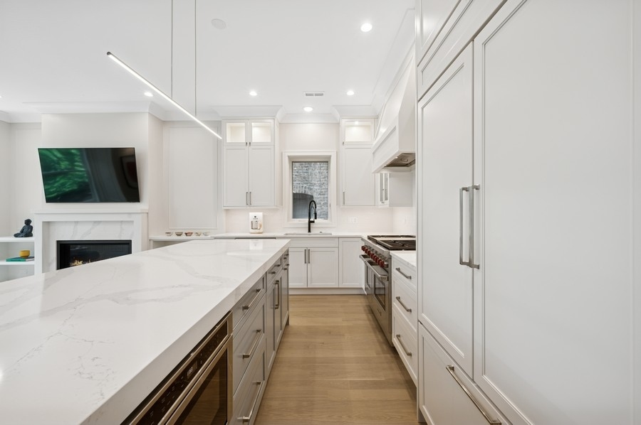 2136 North Cleveland Avenue, Unit 2 Chicago, IL 60614 - Photo 17 of 38 a kitchen with a sink stove and refrigerator