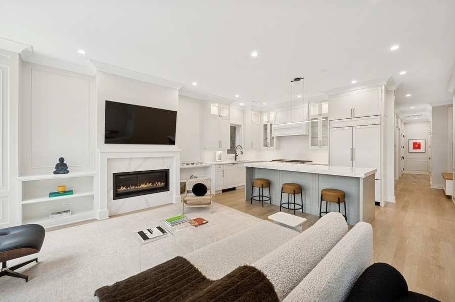 2136 North Cleveland Avenue, Unit 2 Chicago, IL 60614 - Photo 21 of 38 a living room with furniture a fireplace and a flat screen tv