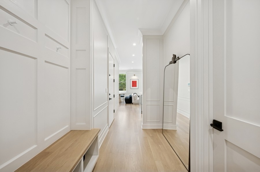 2136 North Cleveland Avenue, Unit 2 Chicago, IL 60614 - Photo 6 of 38 a view of a hallway with wooden floor and staircase