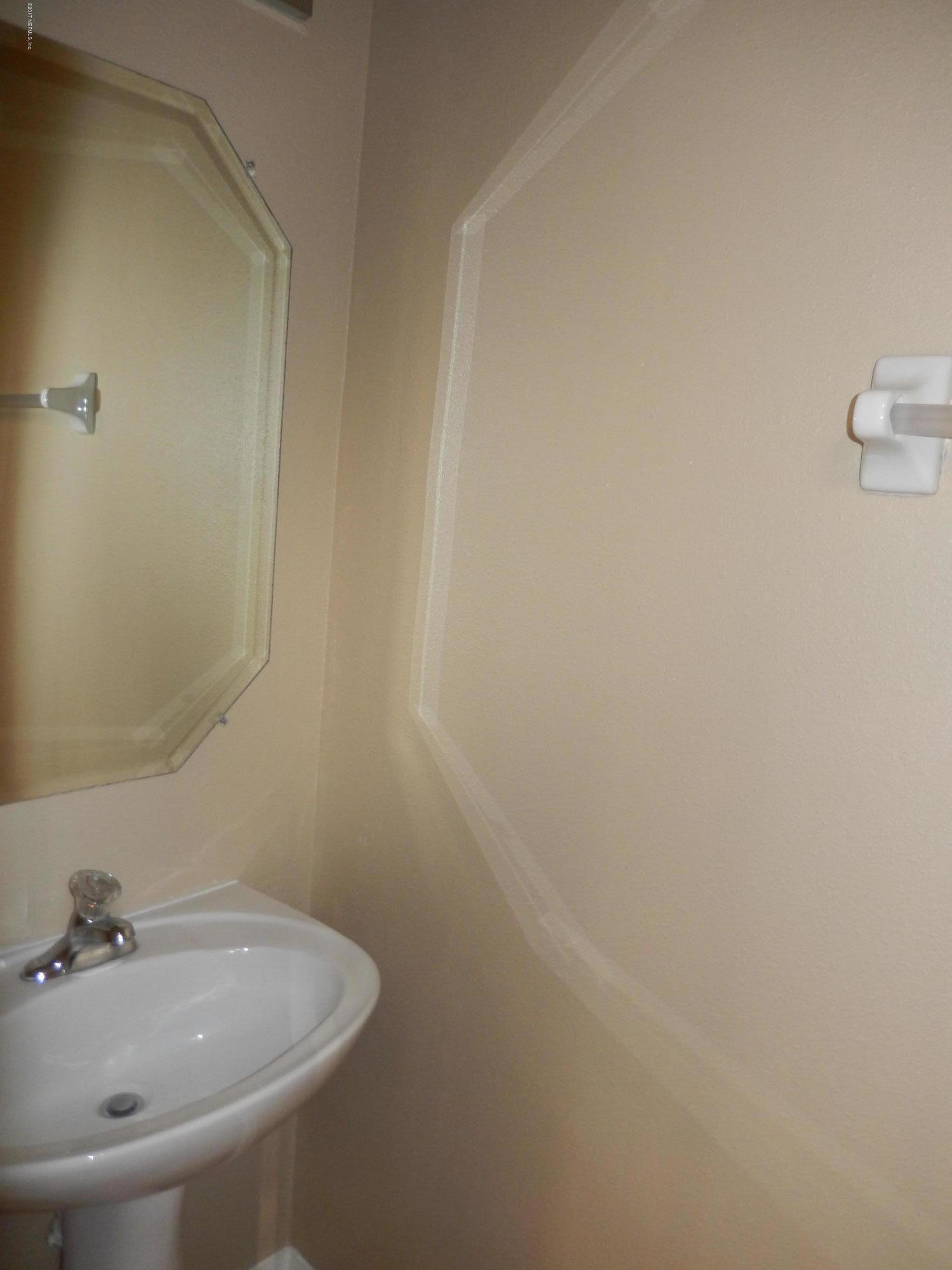 778 Ginger Mill Drive Jacksonville, FL 32259 - Photo 12 of 19 a bathroom with a sink and a mirror