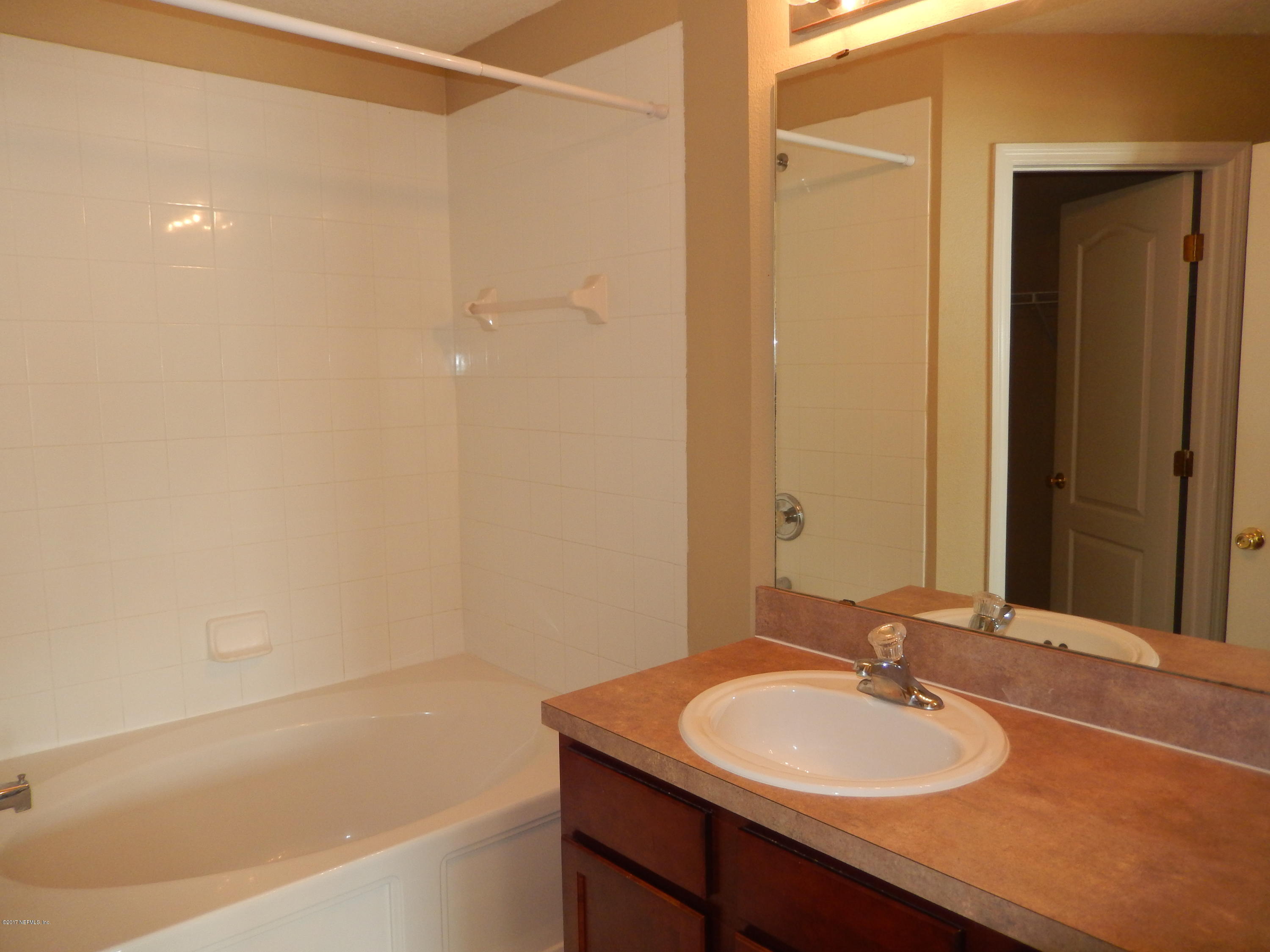 778 Ginger Mill Drive Jacksonville, FL 32259 - Photo 14 of 19 a bathroom with a sink and a mirror