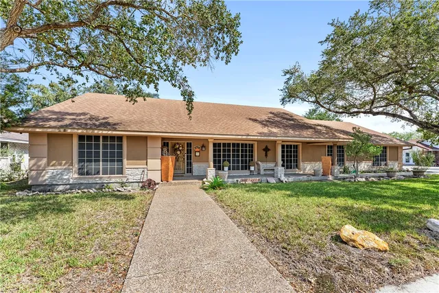 front view of a house with garden
