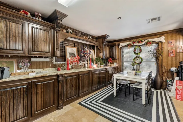 a kitchen with stainless steel appliances granite countertop a sink and cabinets