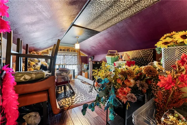a view of a chairs and table in backyard