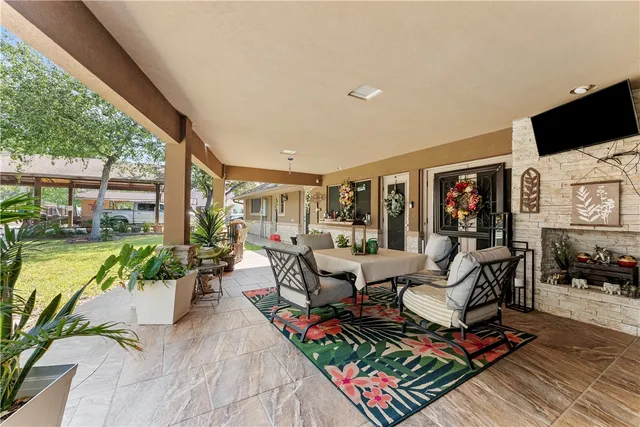 a living room with fireplace furniture and a flat screen tv
