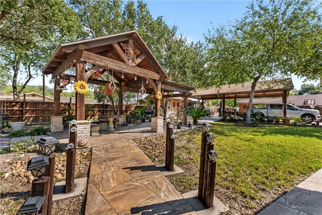 a front view of a house with garden